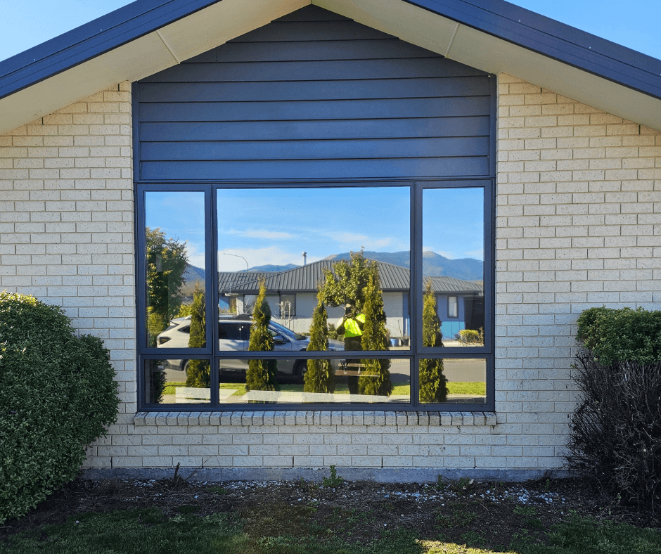 Installation of one way privacy window film on residential property for added protection